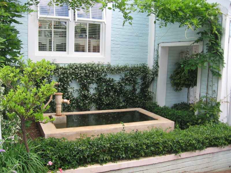 Lovely pond with old fashioned pump